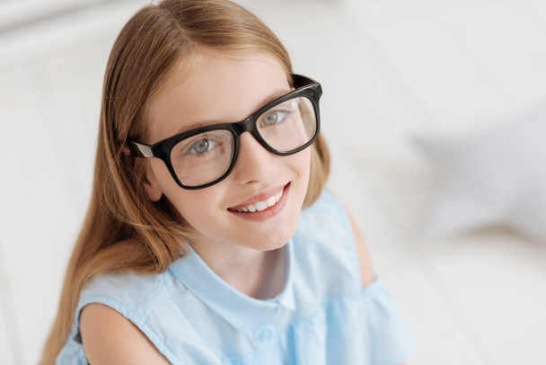 Portrait of adorable girl wearing glasses smiling - Foto, Imagen