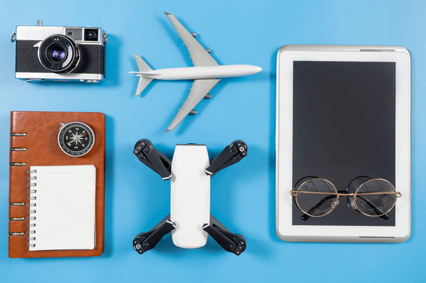 Travel blogger technology objects and gadgets on blue - Photo, Image