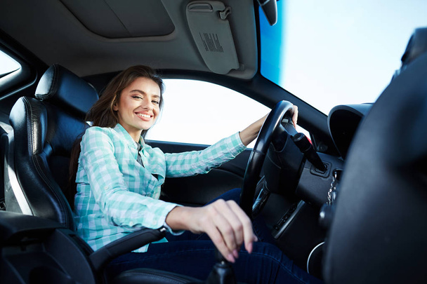 Exited woman in new automobile  - Photo, Image