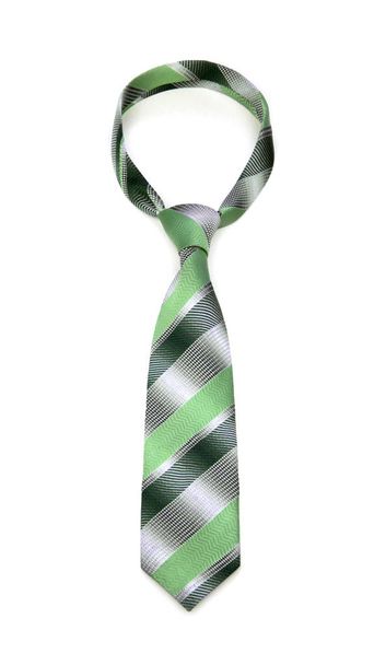 стильный связанный серый и лаймово-зеленый полосатый галстук изолирован на белом фоне
 - Фото, изображение