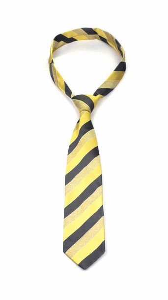 corbata de rayas amarillas y grises atada con estilo aislada sobre fondo blanco
 - Foto, Imagen