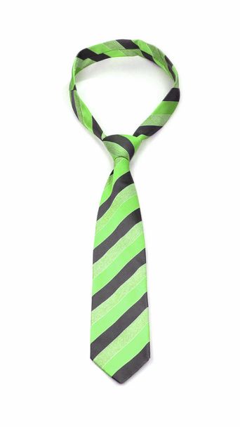 Stylowy wiązany Limonkowy i szary krawat w paski na białym tle - Zdjęcie, obraz