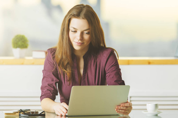 Attractive lady using laptop  - Photo, image