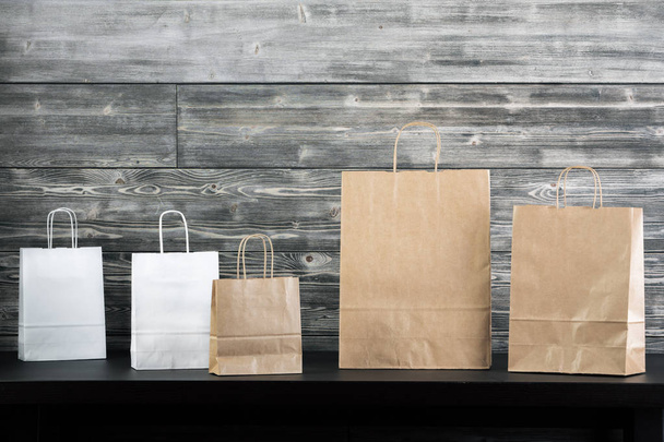 Shopping bags on table  - Foto, Imagen