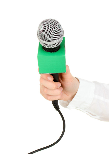 Female hand with microphone isolated on white - Foto, immagini