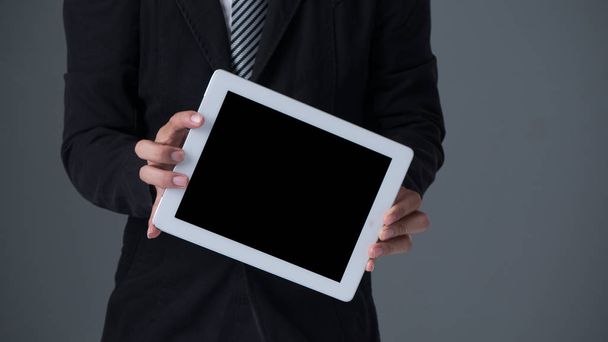 Businessman holding tablet - 写真・画像