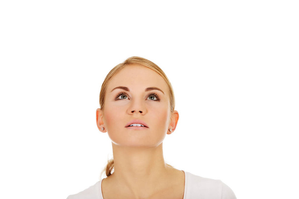 Young woman eyes looking up - Фото, изображение