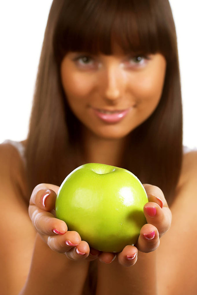 young woman holding a green apple - Foto, Imagen