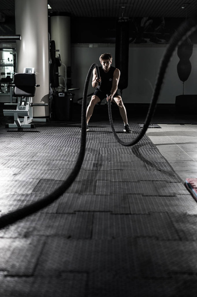 Crossfit battling ropes at gym workout exercise. Crossfit - Photo, Image