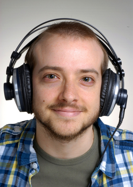 Young man using headphones,Dj listening music. - Foto, imagen