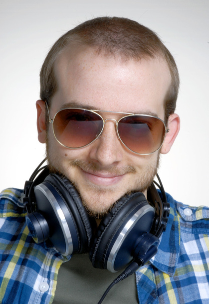 Young man using headphones,Dj listening music. - Foto, afbeelding