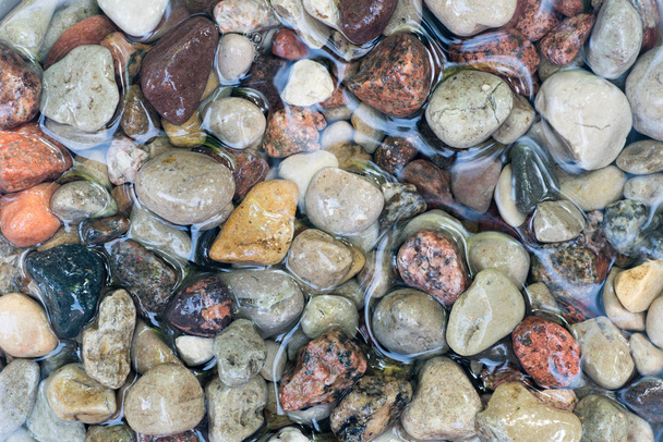 pebble stones in water  - Photo, Image