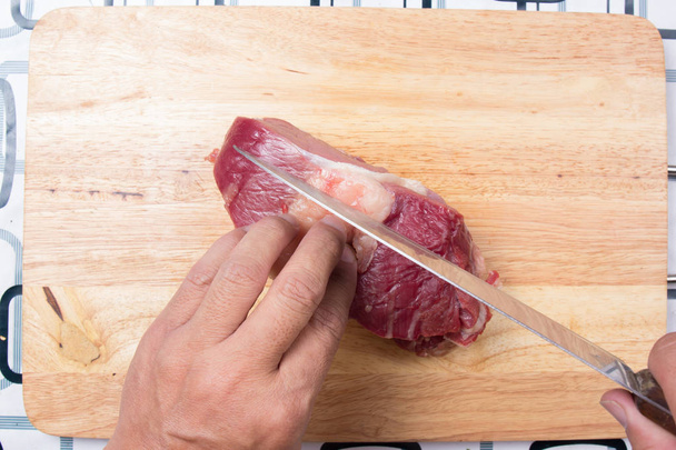 Chef cutting beef before cooking  - Photo, Image