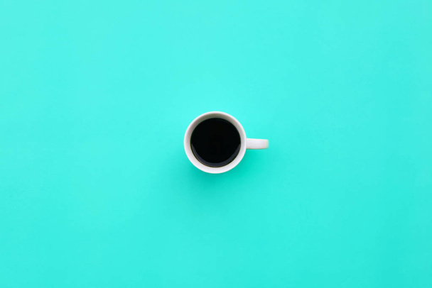 Cup of coffee on blue background - Φωτογραφία, εικόνα