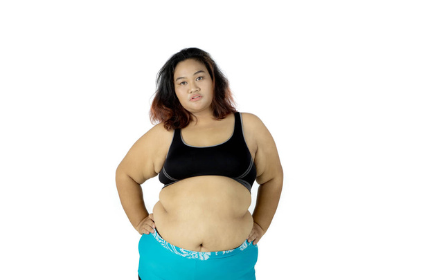 Confident fat woman wearing sportswear - Fotoğraf, Görsel