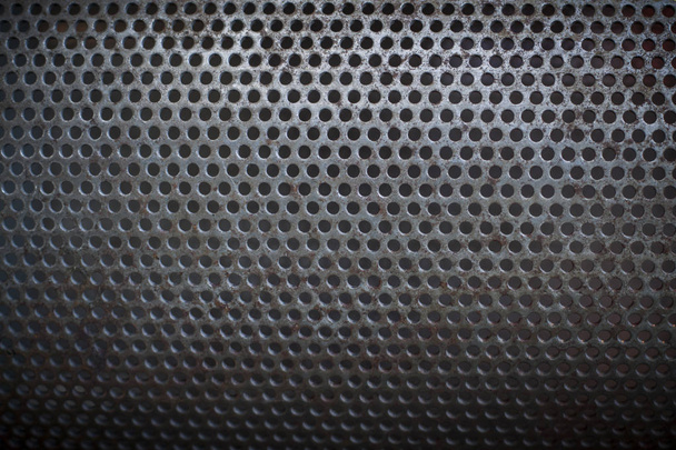 Surface métallique avec de nombreux trous ronds, fond
 - Photo, image