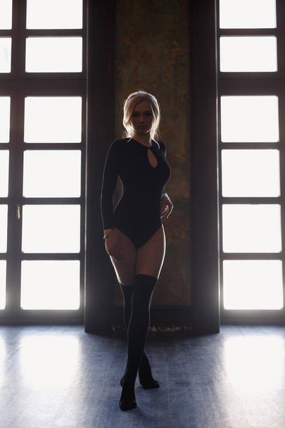 Young blonde woman with perfect body wears bodysuits. - Zdjęcie, obraz