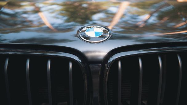 Kazan, RUSSIA july 2017: the hood of the automobile BMW with sign logo on black car - popular luxury sport car - Фото, изображение