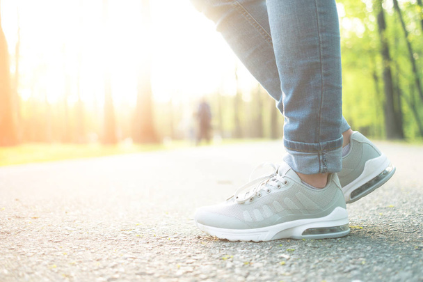 Person standing in gray sporty gumshoes - Fotografie, Obrázek