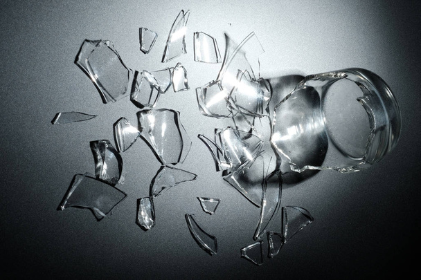 A breaking glass of water on the black background - Photo, image
