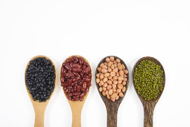 Seeds beans(Black Bean, Red Bean, Peanut and Mung Bean) useful for health in wood spoons on white background. - Φωτογραφία, εικόνα