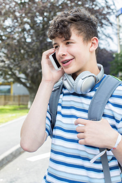 Male Teenage Student Outside College Building Talking On Mobile  - Photo, Image