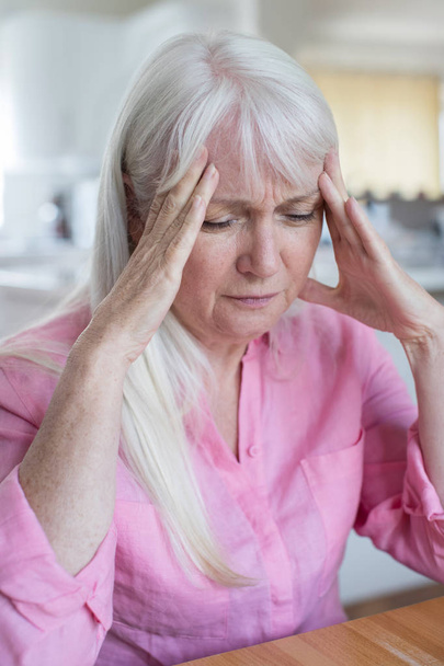Mature Woman At Home Suffering From Headache - Fotoğraf, Görsel