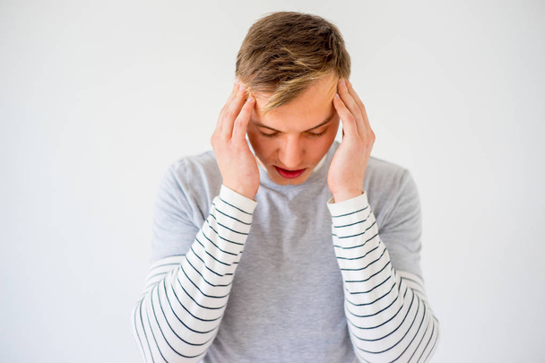 Man having a headache - Foto, afbeelding