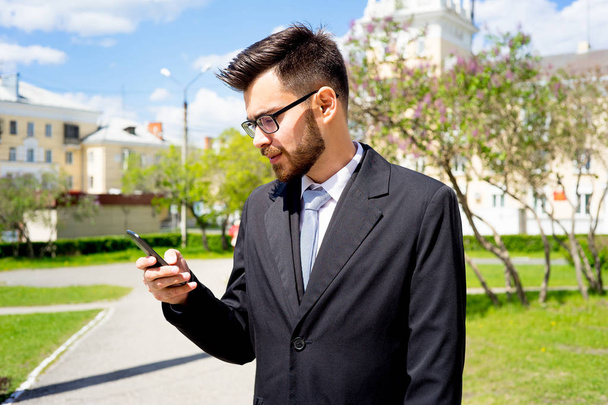 Businessman is texting - Fotó, kép
