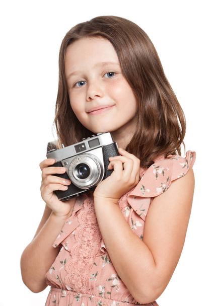 Young brunette girl with vintage camera. - Foto, afbeelding