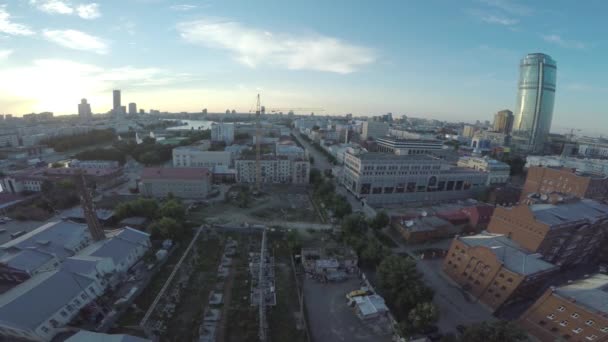 Aerial view of Ekaterinburg city at sunset. Large modern city center viewed from above. Beautiful city aerial view - 映像、動画