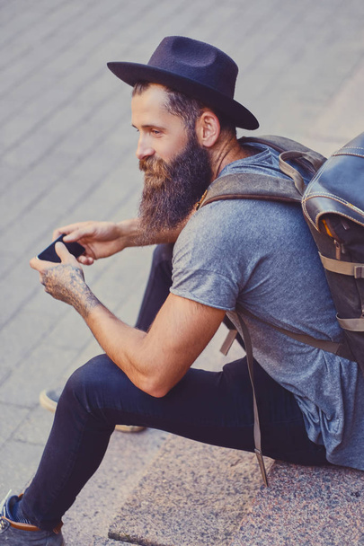 Bearded tattooed traveller - 写真・画像