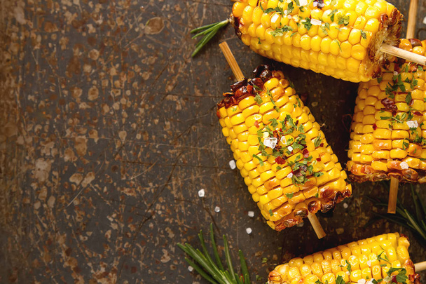 Corn grilled with salt and spices. Dark background. Fast food in - Valokuva, kuva