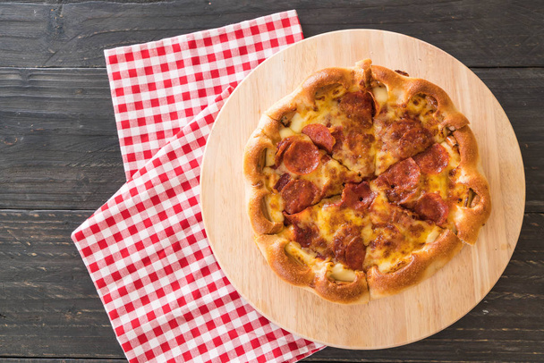 Homemade Pepperoni Pizza on wood plate - Fotó, kép