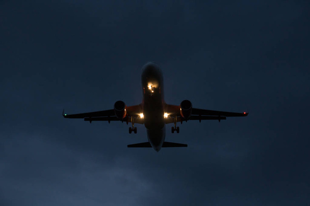 The plane lands at night - Photo, Image
