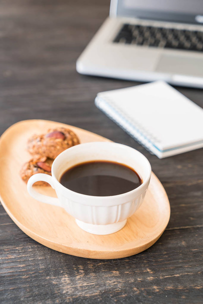 black coffee and cookies with laptop and note book - Фото, изображение