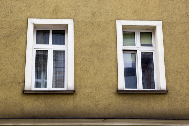 Two Windows on the facade of the yellow house - Valokuva, kuva