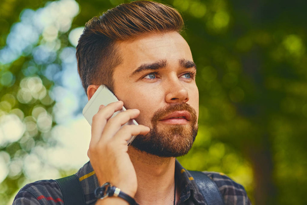 Bearded male using smartphone  - Foto, Imagem