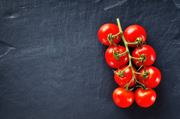 Fresh tomatoes on the branch - Fotó, kép