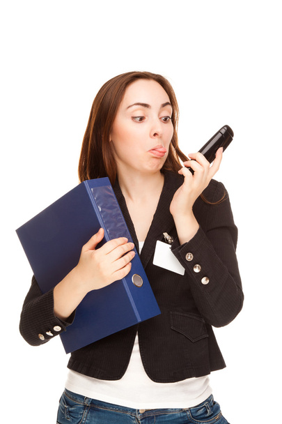 Secretry showing tongue to the phone - Фото, изображение