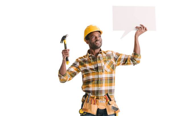 builder holding blank speech bubble - Fotó, kép