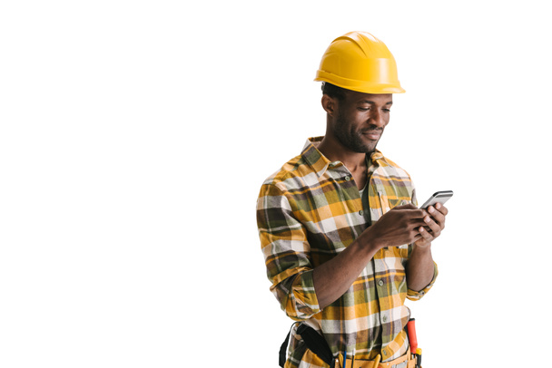 builder texting messege on smartphone - Photo, Image