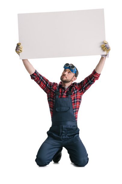 trabajador de la construcción con banner en blanco
 - Foto, Imagen