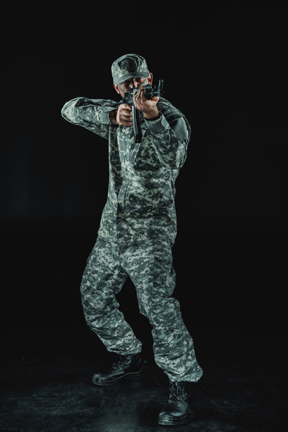 soldier in military uniform with rifle - Foto, Imagem
