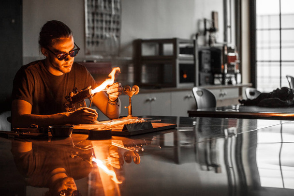 Glassblowing Man Working on a Torch Flame  - Foto, Imagen