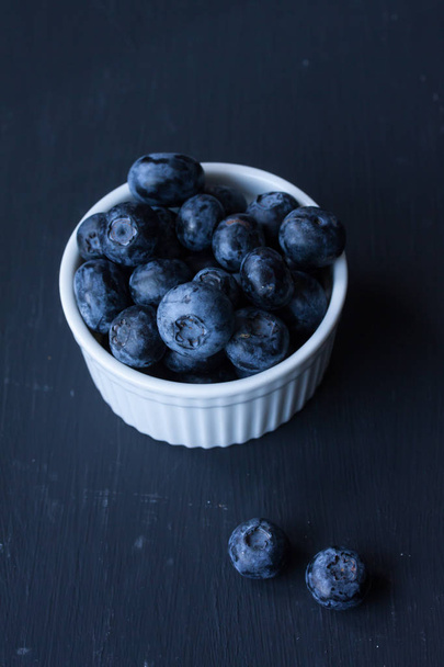 Blueberry on a black background - Foto, afbeelding