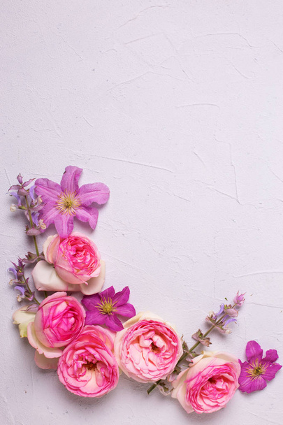 Violet clematis and pink roses flowers - Photo, image
