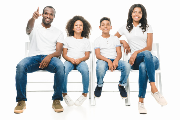 african american family sitting on chairs - Фото, зображення