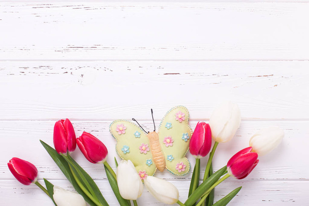Tulips flowers and decorative butterfly - Foto, imagen