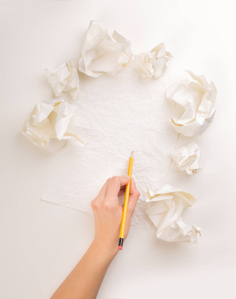 Writing hand in crumpled paper - Photo, image